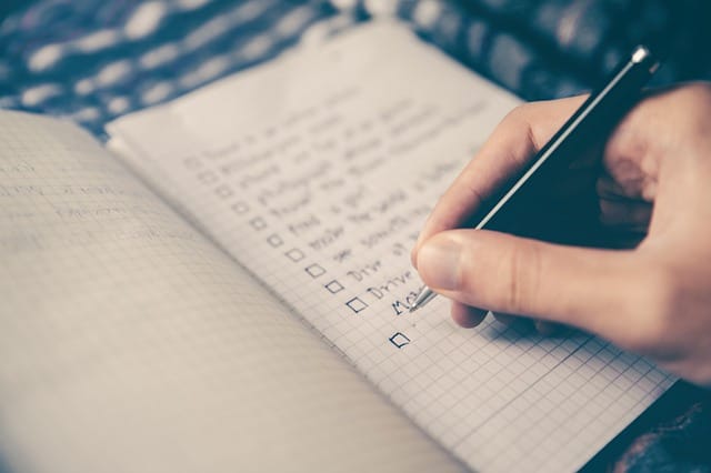 moving day checklist in notebook